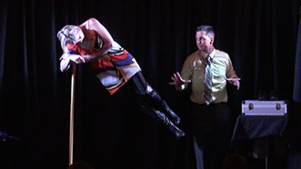 Aaron Paterson levitiates his assistant while performing corporate entertainment for Ontario company Esco Corp.