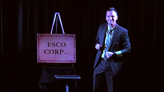 Aaron Paterson performing on stage for Esco Corp with some custom entertainment.