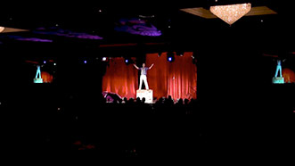 Wide shot of Aaron Paterson performing event entertainment at the WRHBA SAM awards.