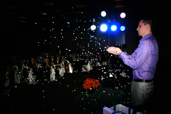 Aaron causes snow to magically shoot from his hands.