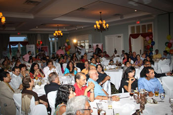 The audience is captivated by Aaron's performance.
