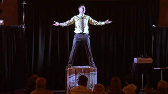 Aaron Paterson magicially appears during performance in Port Hope, Ontario for Esco Corp.