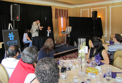 Aaron Paterson performing at an RSA Group corporate luncheon
