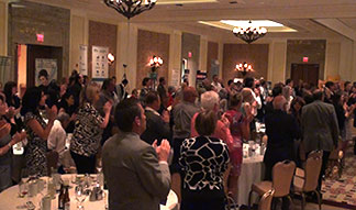 OACC Standing Ovation for Corporate Entertainer Aaron Paterson.