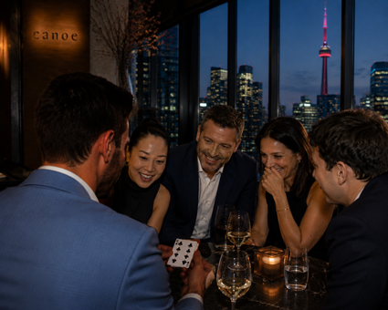 Magician and Mentalist Aaron Paterson performs for a milestone event at Canoe Restaurant with beautiful views of the CN Tower.