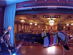 Illusionist Aaron Paterson makes his assistant levitate as entertainment for University and Colleges campuses in Canada