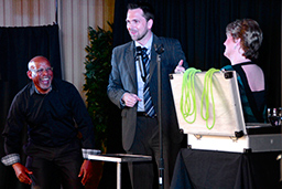 Corporate Entertainers Toronto, Aaron Paterson, one of the most sought after Toronto corporate entertainers with volunteers from the audience making them laugh.