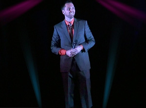 Corporate illusionist Aaron Paterson laughs along with the audience.