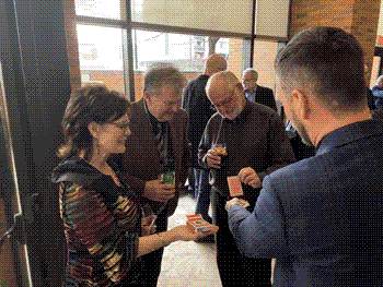 Aaron Paterson recently delivered an unforgettable performance at a corporate cocktail party for Intact Insurance, impressing the company’s executive team, including their Vice President. This is a photo of exceutives reacting to the magic