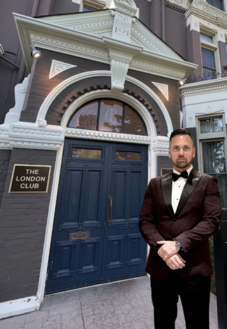 Aaron Paterson poses outside of the London Club before his performance.