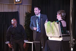 An audience volunteer laughs hysterically at the comedy of Ontario event entertainment professional Aaron Paterson.