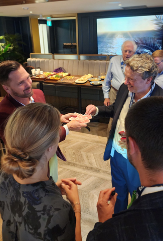 Magician, Aaron Paterson performs for the new CEO of Raymond James limited.